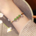 Fortune Jewel 925 Sterling Silver Bamboo Leaves Hetian Jade Chalcedony Beads Blessing Braided Bracelet