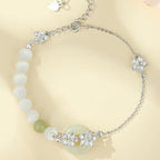 Fortune Jewel 999 Sterling Silver Natural Hetian Jade Peace Buckle Peach Blossom Luck Bracelet