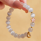Fortune Jewel 925 Sterling Silver Natural Peach Blossom White Cat's Eye Positive Bracelet
