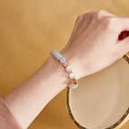 Fortune Jewel 925 Sterling Silver Natural Peach Blossom White Cat's Eye Positive Bracelet