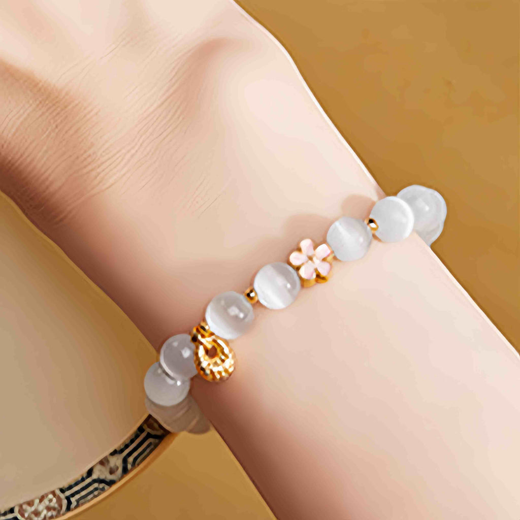 Fortune Jewel 925 Sterling Silver Peach Blossom Lucky Bag White Cat's Eye Luck Bracelet