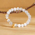 Fortune Jewel 925 Sterling Silver Peach Blossom Lucky Bag White Cat's Eye Luck Bracelet