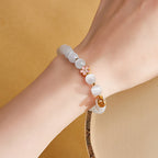 Fortune Jewel 925 Sterling Silver Peach Blossom Lucky Bag White Cat's Eye Luck Bracelet