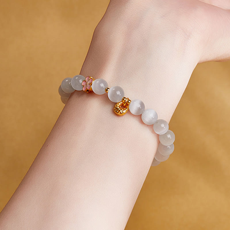 Fortune Jewel 925 Sterling Silver Peach Blossom Lucky Bag White Cat's Eye Luck Bracelet