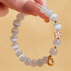 Fortune Jewel 925 Sterling Silver Peach Blossom Lucky Bag White Cat's Eye Luck Bracelet