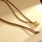 Fortune Jewel Cute Cat Copper Plated Gold Adjustable Braided Rope Protection Necklace Pendant