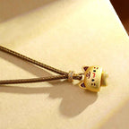 Fortune Jewel Cute Cat Copper Plated Gold Adjustable Braided Rope Protection Necklace Pendant
