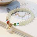 Fortune Jewel Natural Hetian White Jade 14K Gold Plated Money Bag Blessing Bracelet