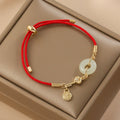 Fortune Jewel 18K Gold Plated Hetian Jade Peace Buckle Fu Character Luck Red Rope Bracelet