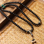 108 Mala Beads Bracelet in Natural Indonesian Black Gold Coconut Crown with Tibetan Silver Guru Bead