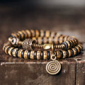 Double-Wrap Tibetan-Style Hand-Carved Bone Bead Bracelet with Ebony Spacers, Brass Accents, and Agate Dzi Charm