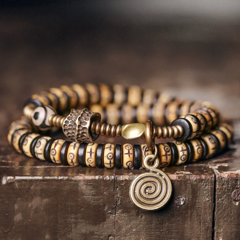 Double-Wrap Tibetan-Style Hand-Carved Bone Bead Bracelet with Ebony Spacers, Brass Accents, and Agate Dzi Charm