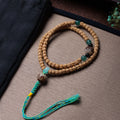 Cypress Seed 108 Mala Beads Bracelet with Straight-Cut Ghost Face – Handcrafted in Tibet