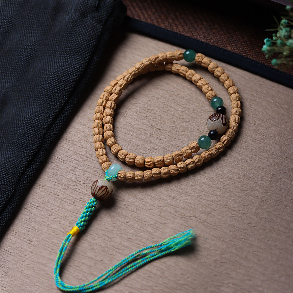 Cypress Seed 108 Mala Beads Bracelet with Straight-Cut Ghost Face – Handcrafted in Tibet