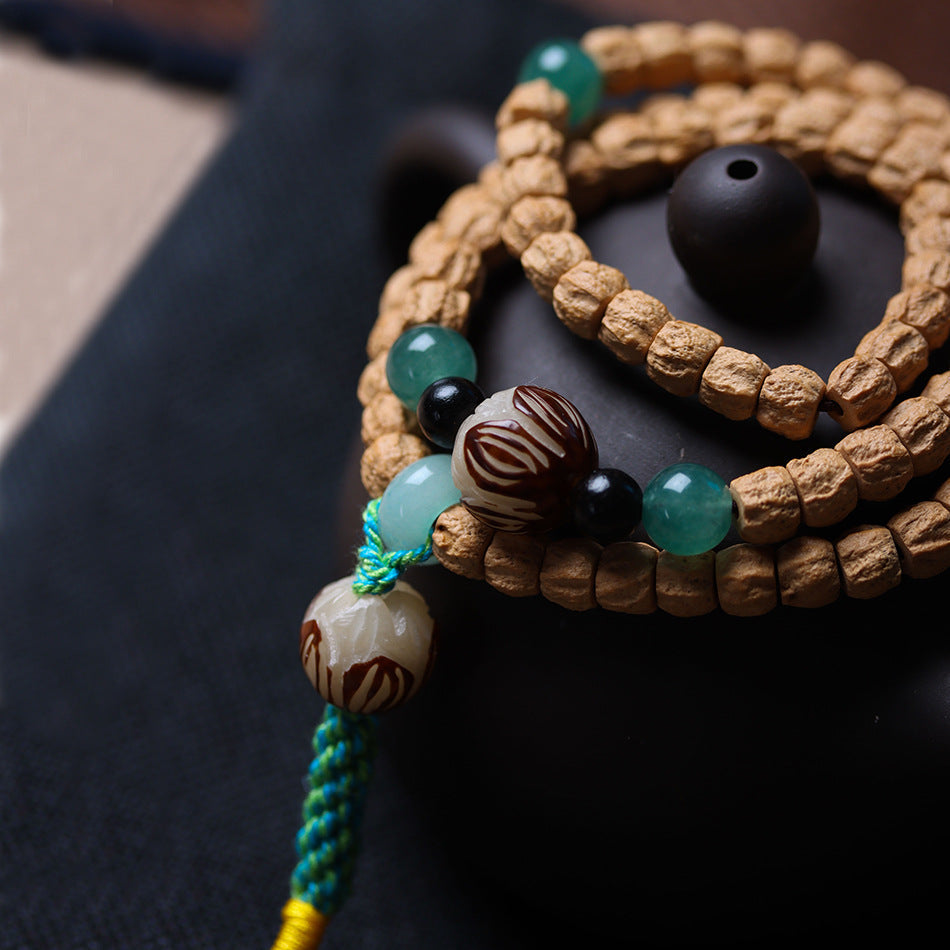 Cypress Seed 108 Mala Beads Bracelet with Straight-Cut Ghost Face – Handcrafted in Tibet