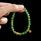 Women’s Handcrafted Aged Green Hetian Jade Bracelet with Golden Charms