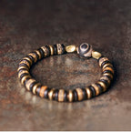 Tibetan-Style Hand-Carved Bone Bead Bracelet with Ebony and Brass Spacers, and Agate Dzi