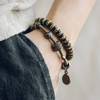 Double-Wrap Tibetan-Style Hand-Carved Bone Bead Bracelet with Ebony Spacers, Brass Accents, and Agate Dzi Charm