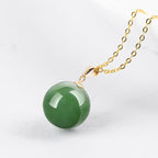 Natural Spinach Green Aged Hetian Jade Round Bead Pendant, beautifully set in 18K gold