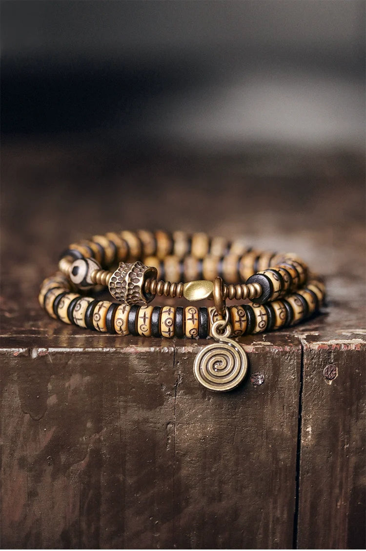 Double-Wrap Tibetan-Style Hand-Carved Bone Bead Bracelet with Ebony Spacers, Brass Accents, and Agate Dzi Charm
