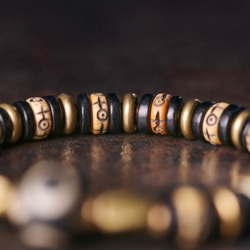 Tibetan-Style Hand-Carved Bone Bead Bracelet with Ebony and Brass Spacers, and Agate Dzi