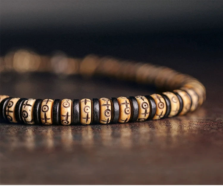 Double-Wrap Tibetan-Style Hand-Carved Bone Bead Bracelet with Ebony Spacers, Brass Accents, and Agate Dzi Charm