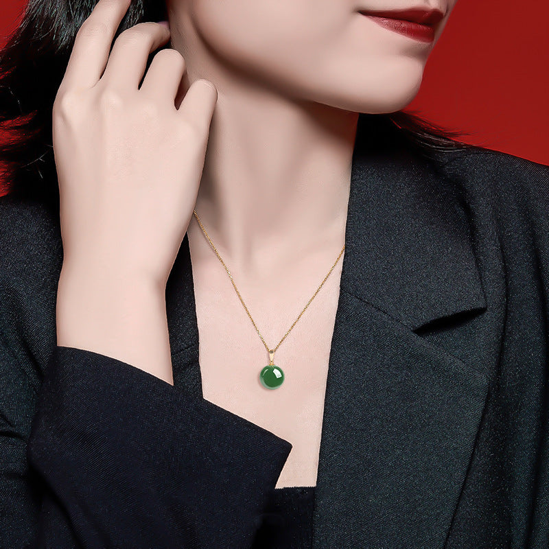 Natural Spinach Green Aged Hetian Jade Round Bead Pendant, beautifully set in 18K gold