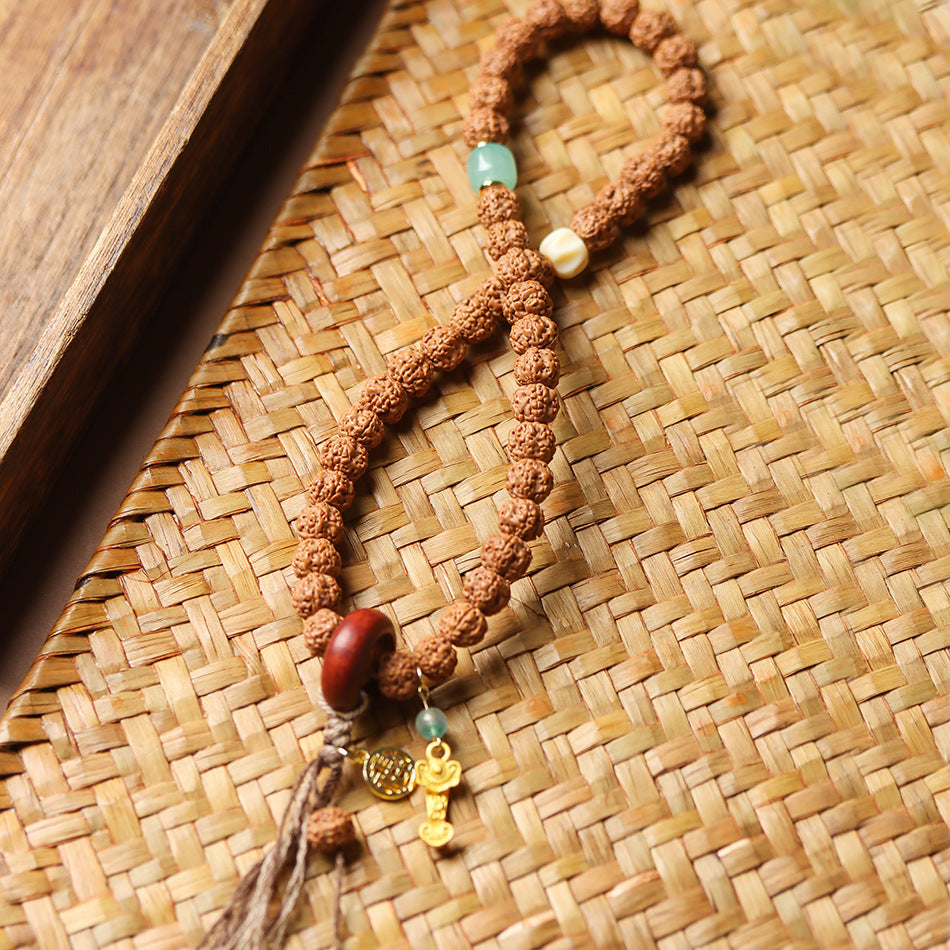 Double Wrap Rudraksha Bracelet with Sandalwood Ring and Gold Ruyi Charm