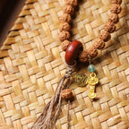 Double Wrap Rudraksha Bracelet with Sandalwood Ring and Gold Ruyi Charm