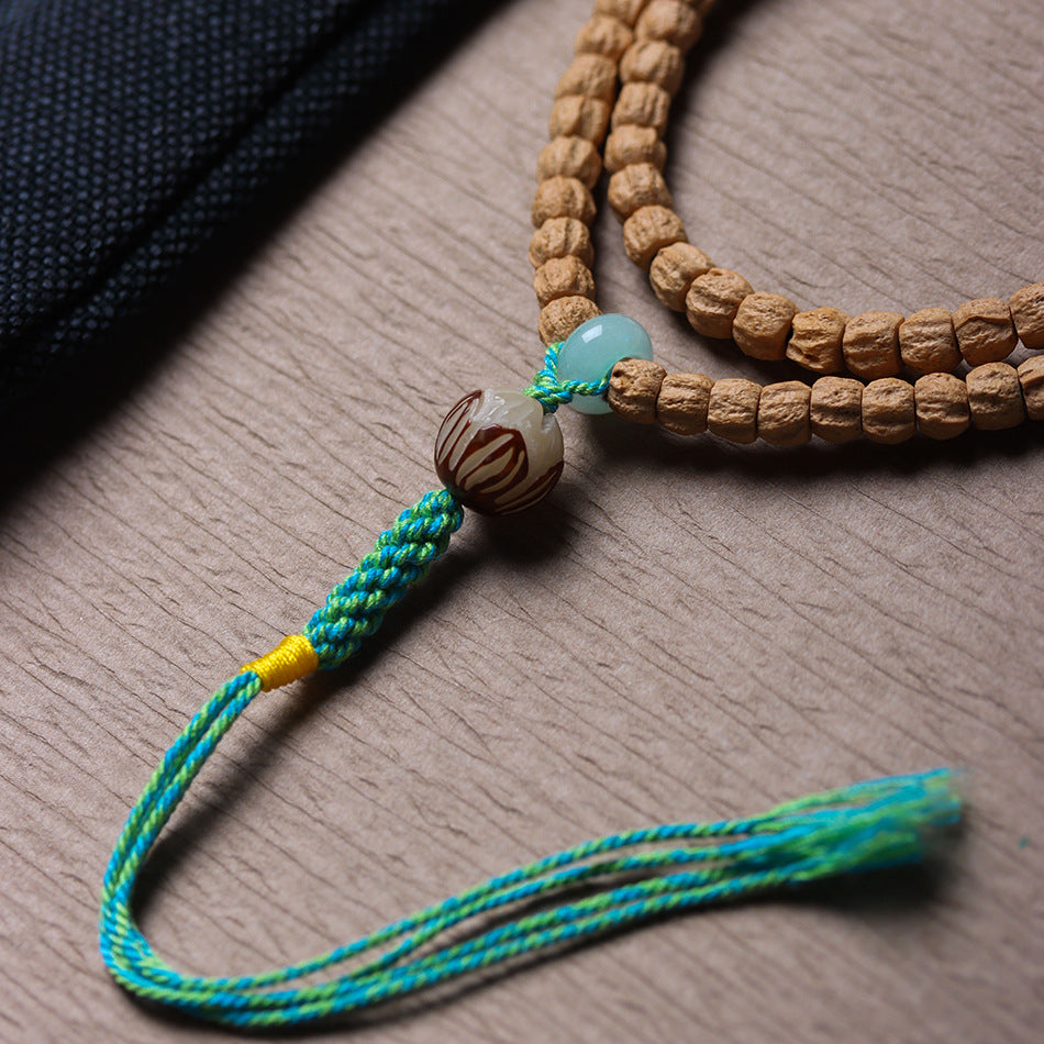 Cypress Seed 108 Mala Beads Bracelet with Straight-Cut Ghost Face – Handcrafted in Tibet