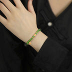 Women’s Handcrafted Aged Green Hetian Jade Bracelet with Golden Charms