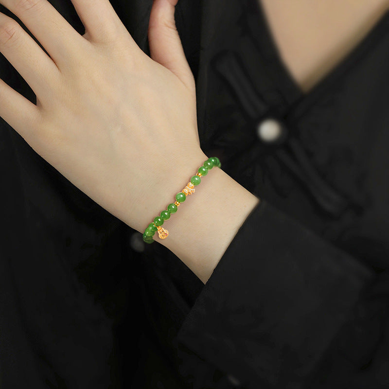 Women’s Handcrafted Aged Green Hetian Jade Bracelet with Golden Charms