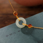 Fortune Jewel 925 Sterling Silver Plated Gold Natural Hetian Jade Peace Buckle Red Agate Luck Bracelet