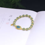 Fortune Jewel 925 Sterling Silver Plated 14K Gold Hetian Jade Lotus Luck Bracelet